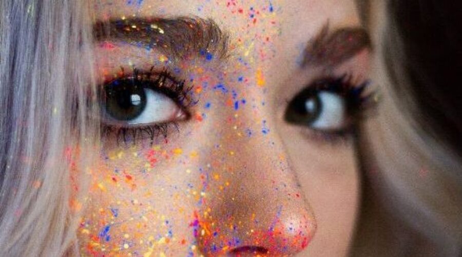Paint splatter on woman's face - cure for eczema