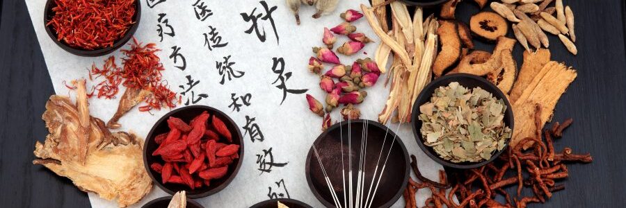 Herbs in small bowls on scroll with Chinese script - oriental medicine dermatology