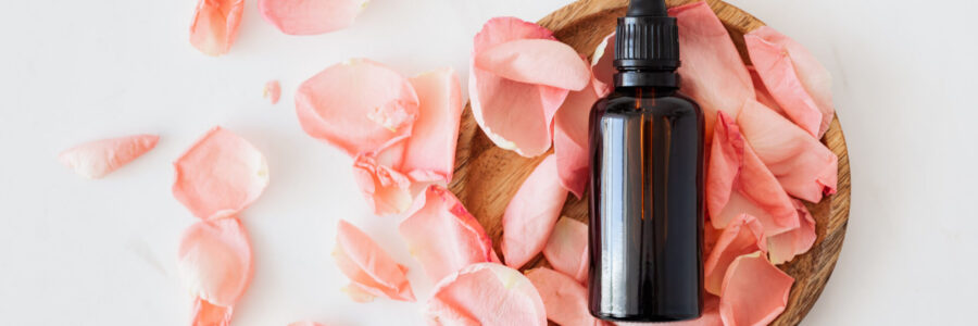 Rose pedals and oil canister - essential oils for skin