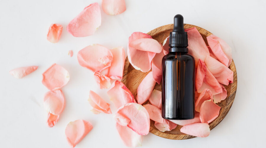 Rose pedals and oil canister - essential oils for skin